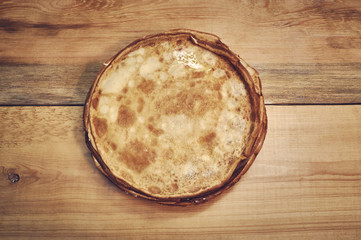 pancakes on old wooden table. Top view