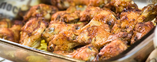 Roasted chicken wings - banner design - macro, closeup