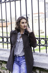 young brunette lady posing on the streets