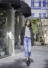 young brunette lady posing on the streets
