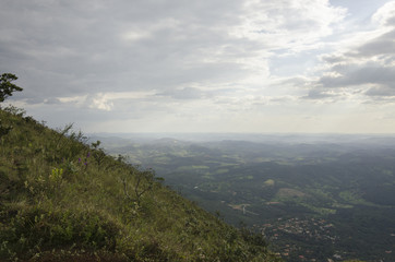 A sunset in clouds by the mountain