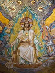 Fototapeta na wymiar Gold mosaic on the ceiling of the Basilica of the Sacre Coeur in Montmartre, Paris. It is one of the largest gold mosaics in the world.