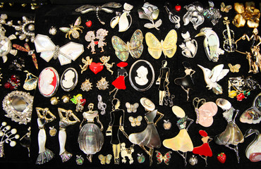 Lots of different jewelry brooches