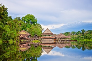 Natural wooden house constructed on a river