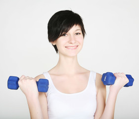 fitness woman with dumbbells.