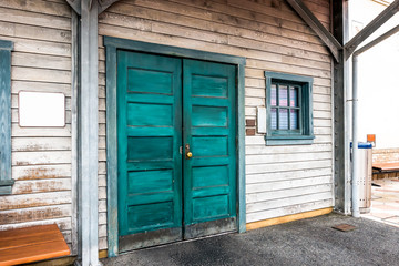 The old wooden door and glass window in frame