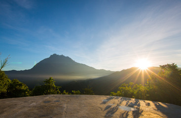 Obraz premium beautiful view of sunrise with mountain and ray of light 