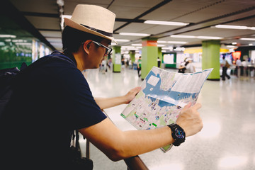 Tourist male with map