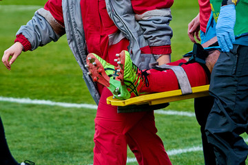 doctors take away from the field injured player