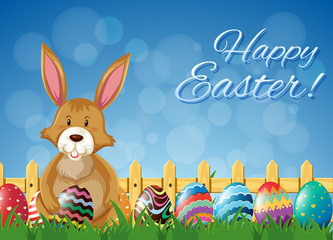 Brown bunny and decorated eggs for easter