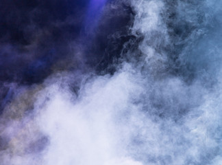 Multi-colored smoke at the concert at night