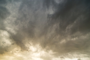 Storm clouds in the sky at sunset as background