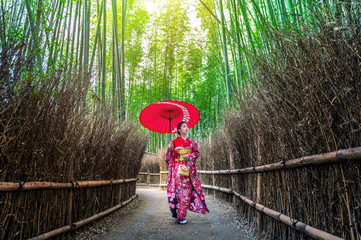 Bamboo Forest. Asian woman wearing japanese traditional kimono at Bamboo Forest in Kyoto, Japan.