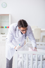 Doctor preparing for baby vaccination