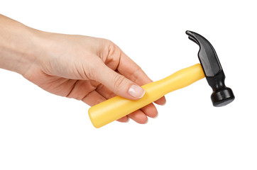 Yellow plastic toy hammer, kid workshop game tool in hand. Isolated on white background