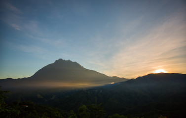 beautiful view of sunrise with mountain and ray of light 