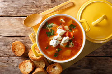 Chicken buffalo soup with vegetables and blue cheese close-up in a saucepan. horizontal top view