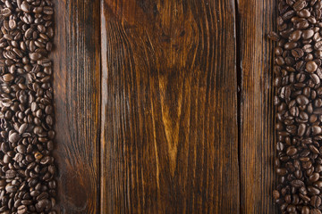 roasted coffee beans on wood texture