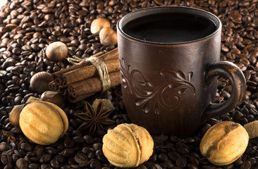 clay cup with coffee on the background of grains