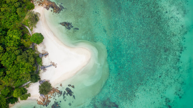 Bird eyes view on top Beautiful beach with white sand and blue sea use drone