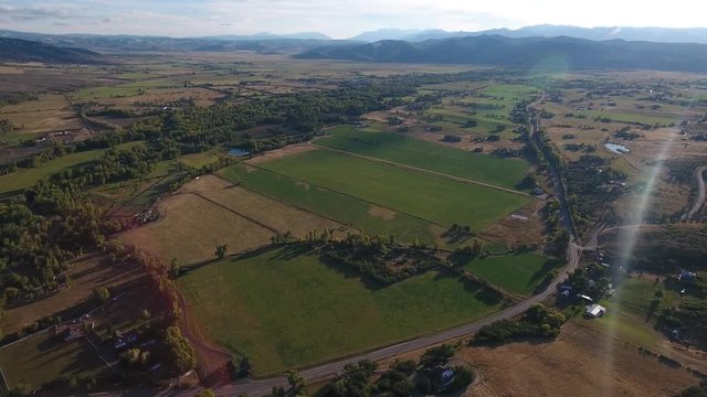 Aerial farmers fields in a mountain valley. 