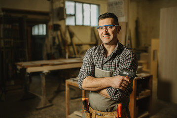 carpenter works with manual and electric equipment
