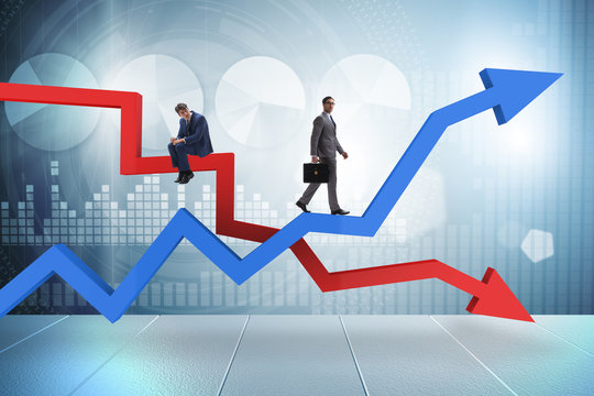 Businessman with charts of growth and decline