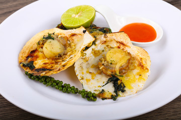 Baked scallops with spinach