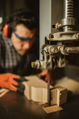 carpenter works with manual and electric equipment