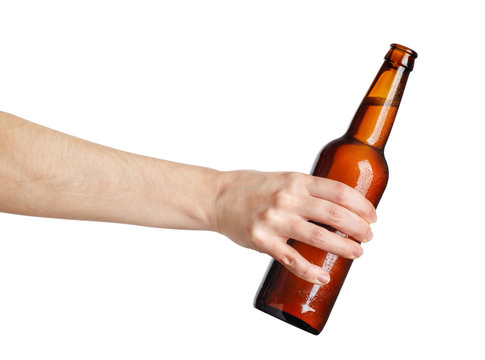 female hand with beer brown bottle