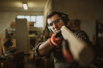 carpenter works with manual and electric equipment