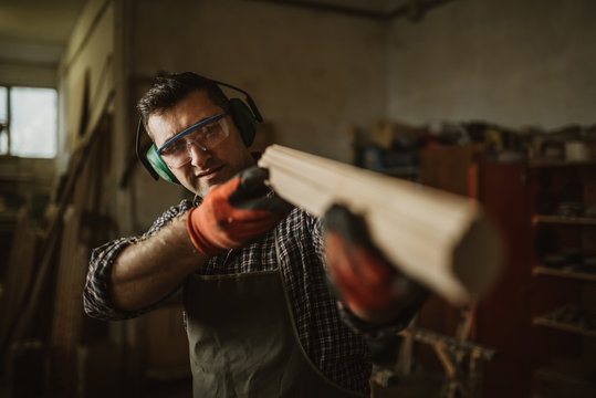 carpenter works with manual and electric equipment