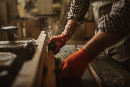 carpenter works with manual and electric equipment