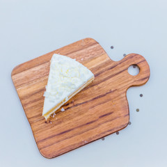 BEAUTIFUL DELICIOUS CAKE ON WOODEN PLATE