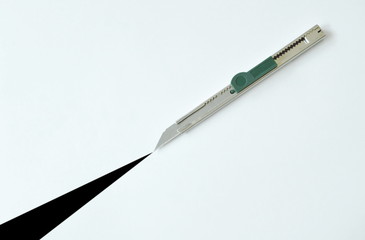 cutter slashing on white paper background