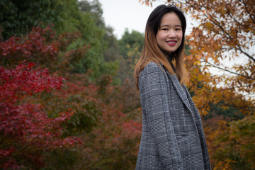 Beautiful woman posing in a Japanese garden