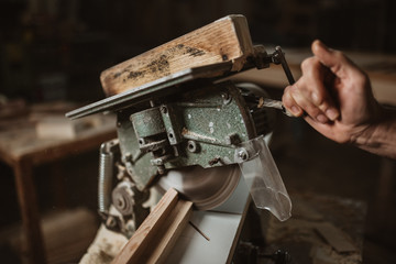 carpenter works with manual and electric equipment