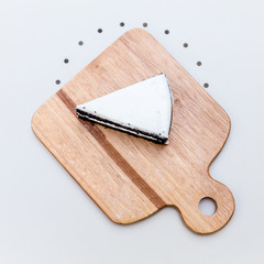 ิbeautiful desert cake on wooden tray