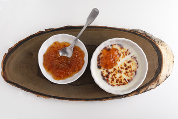 Cheese in milk with cloudberry jam