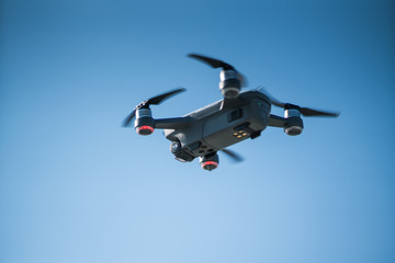 Fototapeta na wymiar Mini drone flying in the sky