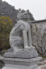 Obraz premium Ancient sculpture at the entrance of Hoa Lu Temples of the Dinh and Lee Dynasties near Ninh Binh in Vietnam, Asia