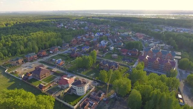 Panoramic Aerial view over on residential houses in the countryside, yards and suburban communities in residential neighborhoods