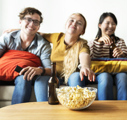 Group of diverse friends having a movie night