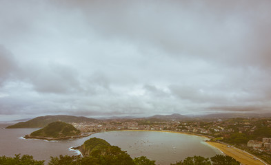 Teal and orange mood of Bay of la Concha in San Sebastian, Spain