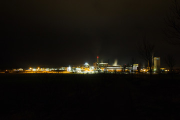 Fototapeta na wymiar The Zielitz potash plant by night. It`s a mine for the mining of potash salts and the associated processing plant at Zielitz in Saxony-Anhalt. t is the largest potash mine in Germany and one of the la