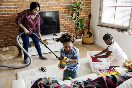 Black Family Cleaning The House Together