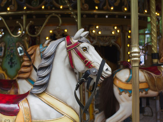 Fototapeta na wymiar Classical carousel attraction with impressive hoses close-up