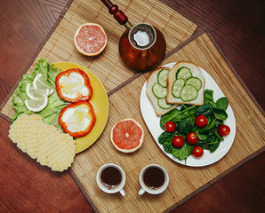 natural and healthy breakfast with toast, coffee and vegetables for vegetarian