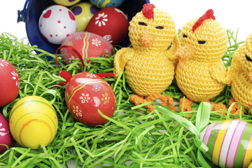 Easter chicken, eggs and decoration on white background