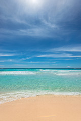 Fototapeta na wymiar White sandy beach with turquoise sea on Paradise island.